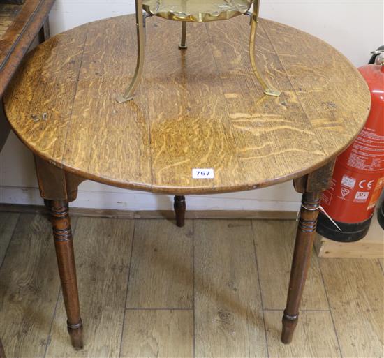 An oak circular table, 71cm high